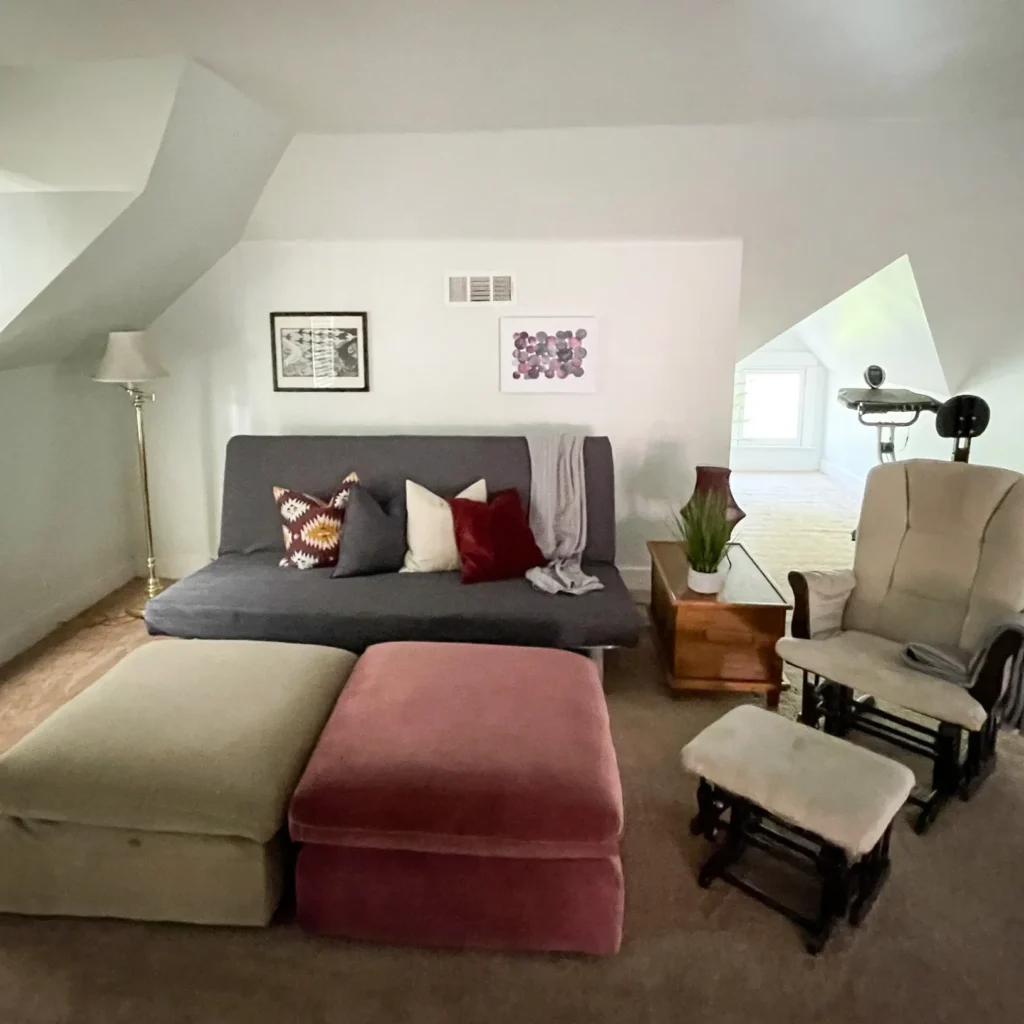 A futon couch and two Ottomans in the Master Suite.